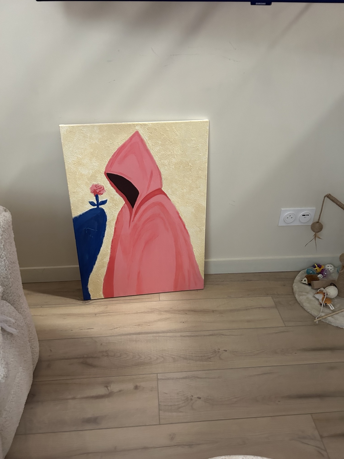 Tableau de Laureen représentant une silhouette à capuche rose